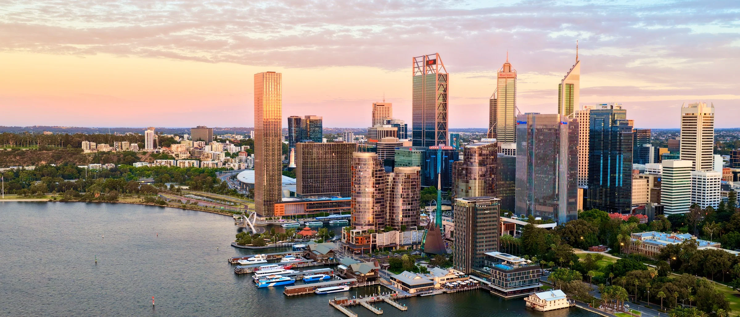 Aerial view of the Perth city skyline and Elizabeth Quay at sunset.